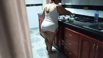 Busty Milf Gives A Handjob While Her Friend'S Mom Cleans The Kitchen